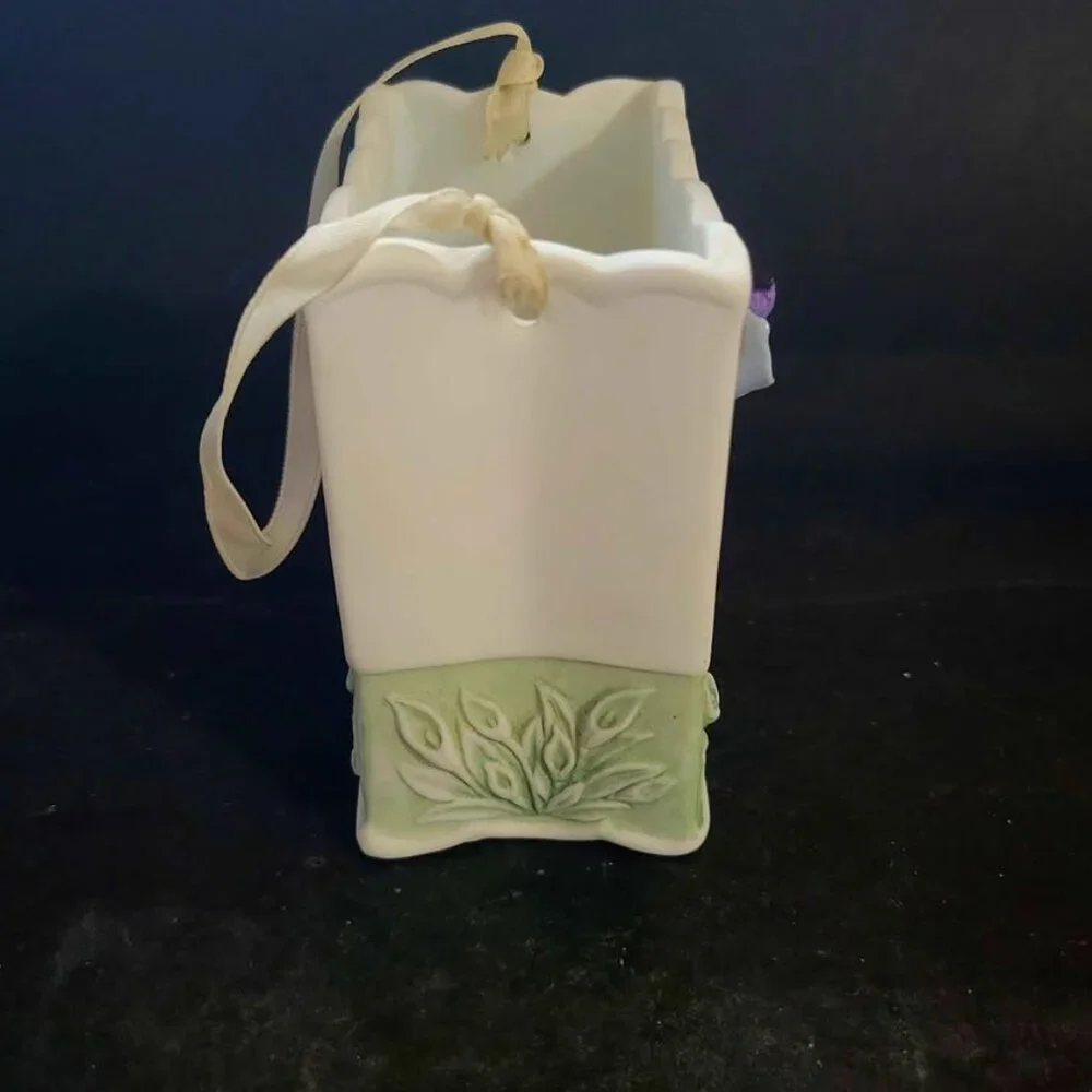 Vintage Porcelain Basket With Floral Embellishments And Decorative Ribbon